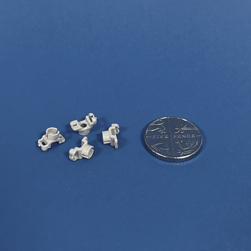 Manufacture of complex miniature moulded plastic part used in vision inspection equipment in textile processing. Moulded plastics by OF Bell, Bishop Auckland.